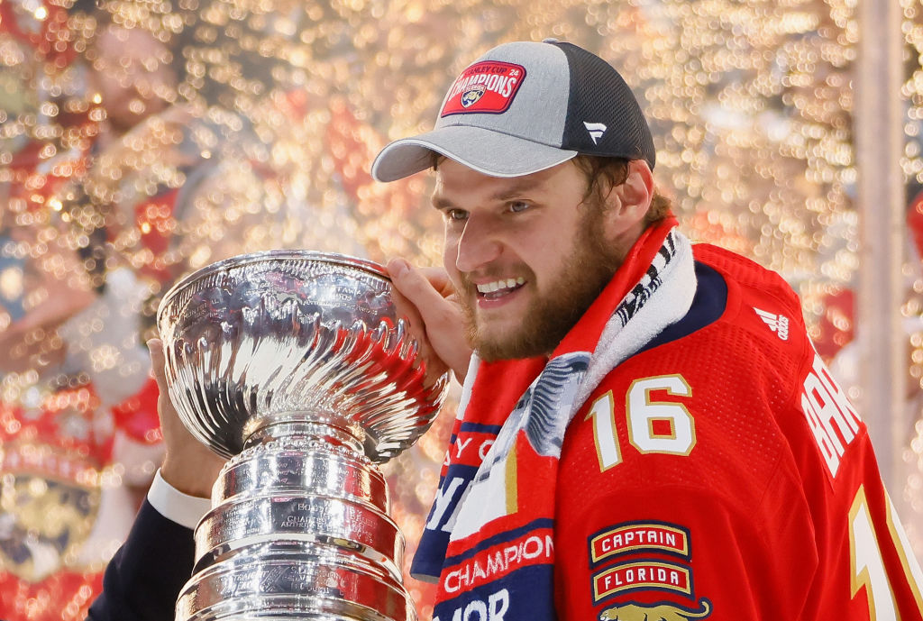 SUNRISE, FLORIDA - JUNE 24: Aleksander Barkov #16 of the Florida Panthers celebrates with the Stanley Cup following a 2-1 victory over the Edmonton Oilers in Game Seven of the 2024 NHL Stanley Cup Final at Amerant Bank Arena on June 24, 2024 in Sunrise, Florida