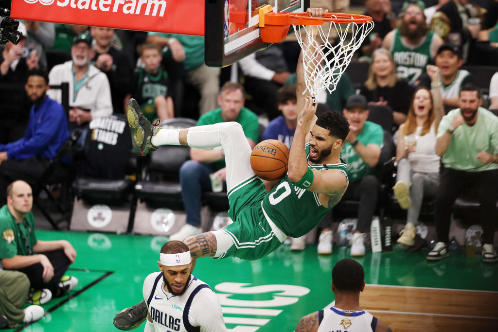 BOSTON, MASSACHUSETTS - JUNE 17: Jayson Tatum #0 of the Boston Celtics reacts after a dunk during the third quarter of Game Five of the 2024 NBA Finals against the Dallas Mavericks at TD Garden on June 17, 2024 in Boston, Massachusetts.