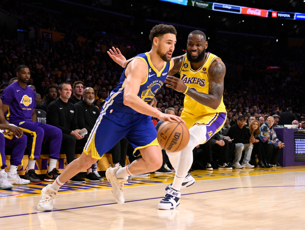 Los Angeles, CA - May 12: Klay Thompson #11 of the Golden State Warriors drives to the basket against LeBron James #6 of the Los Angeles Lakers in the first half of game 6 of a Western Conference Semifinals NBA playoff basketball game at the Crypto.com Arena in Los Angeles on Friday, May 12, 2023. 