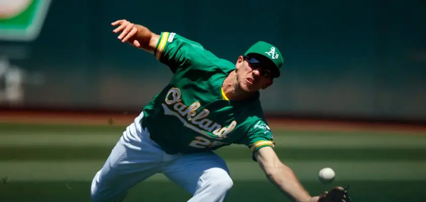 OAKLAND, CA - JUNE 02: Stephen Piscotty #25 of the Oakland Athletics dives for but is unable to field a foul ball hit off the bat of Myles Straw (not pictured) of the Houston Astros during the fifth inning at the Oakland Coliseum on June 2, 2019 in Oakland, California