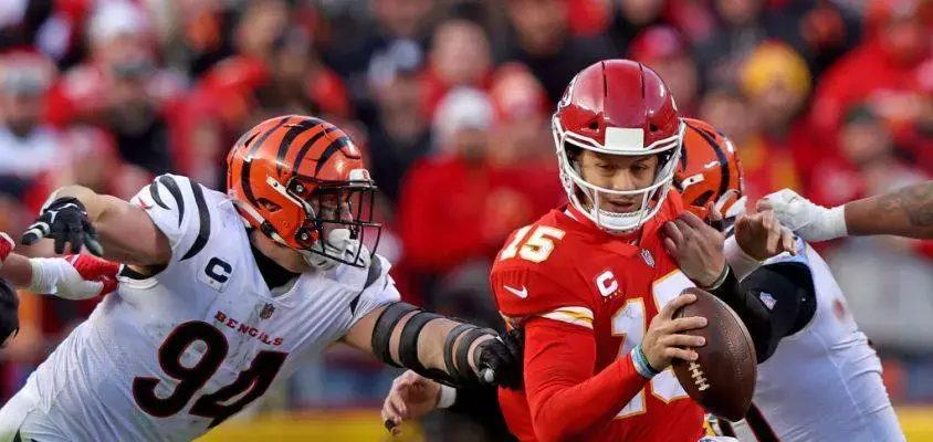 KANSAS CITY, MISSOURI - JANUARY 30: Defensive end Sam Hubbard #94 of the Cincinnati Bengals sacks quarterback Patrick Mahomes #15 of the Kansas City Chiefs during the second half of the AFC Championship Game at Arrowhead Stadium on January 30, 2022 in Kansas City, Missouri