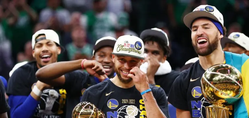 BOSTON, MASSACHUSETTS - JUNE 16: Stephen Curry #30 and Klay Thompson #11 of the Golden State Warriors celebrate after defeating the Boston Celtics 103-90 in Game Six of the 2022 NBA Finals at TD Garden on June 16, 2022 in Boston, Massachusetts