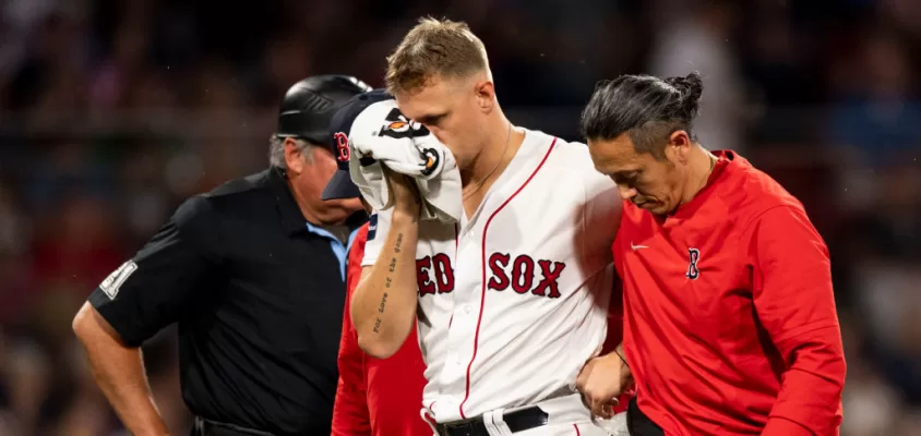 BOSTON, MA - JUNE 16: Tanner Houck #89 of the Boston Red Sox exits the game after being hit in the face with a line drive during the fifth inning against the New York Yankees at Fenway Park on June 16, 2023 in Boston, Massachusetts.