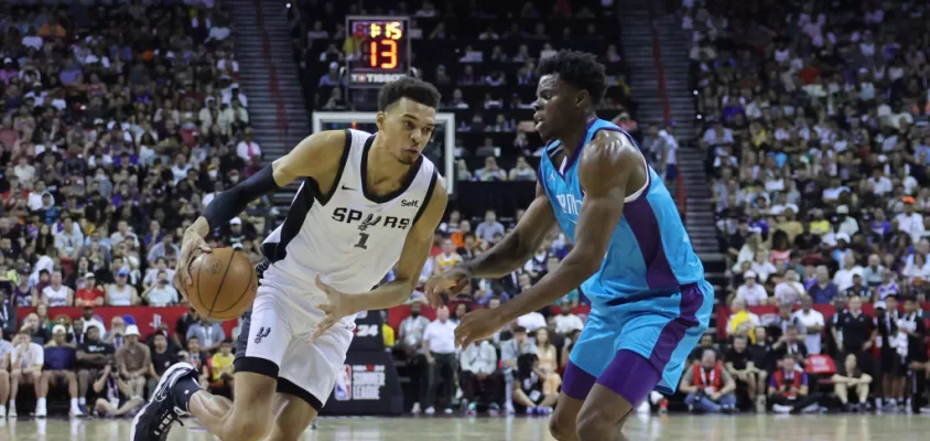 LAS VEGAS, NEVADA - JULY 07: Victor Wembanyama #1 of the San Antonio Spurs drives to the basket against James Nnaji #46 of the Charlotte Hornets during the first quarter at the Thomas & Mack Center on July 07, 2023 in Las Vegas, Nevada.