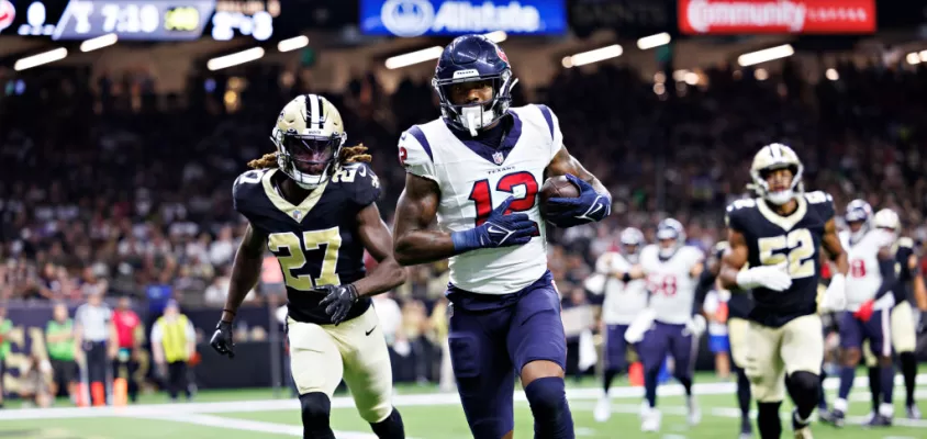 NEW ORLEANS, LOUISIANA - AUGUST 27: Nico Collins #12 of the Houston Texans catches a pass for a touchdown during the preseason game against the New Orleans Saints at Caesars Superdome on August 27, 2023 in New Orleans, Louisiana.