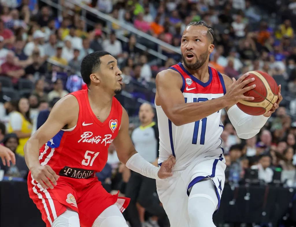 LAS VEGAS, NEVADA - AUGUST 07: Jalen Brunson #11 of the United States drives against Tremont Waters #51 of Puerto Rico in the second half of a 2023 FIBA World Cup exhibition game at T-Mobile Arena on August 07, 2023 in Las Vegas, Nevada. The United States defeated Puerto Rico 117-74.