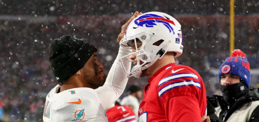 ORCHARD PARK, NEW YORK - DECEMBER 17: Tua Tagovailoa #1 of the Miami Dolphins and Josh Allen #17 of the Buffalo Bills meet on the field after their game at Highmark Stadium on December 17, 2022 in Orchard Park, New York