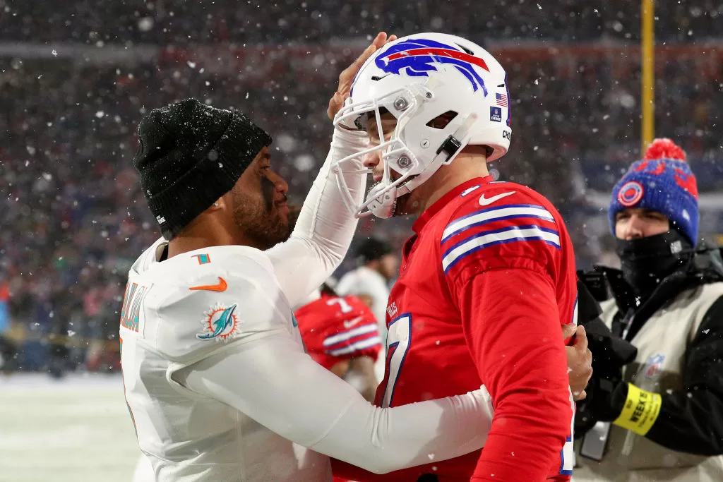 ORCHARD PARK, NEW YORK - DECEMBER 17: Tua Tagovailoa #1 of the Miami Dolphins and Josh Allen #17 of the Buffalo Bills meet on the field after their game at Highmark Stadium on December 17, 2022 in Orchard Park, New York