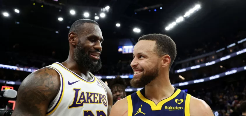 SAN FRANCISCO, CALIFORNIA - JANUARY 27: LeBron James #23 of the Los Angeles Lakers and Stephen Curry #30 of the Golden State Warriors talk to each other after the Lakers beat the Warriors in double overtime at Chase Center on January 27, 2024 in San Francisco, California.