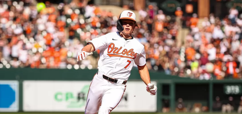 BALTIMORE, MD - APRIL 14: Jackson Holliday #7 of the Baltimore Orioles advances to third base during the seventh inning against the Milwaukee Brewers at Oriole Park at Camden Yards on April 14, 2024 in Baltimore, Maryland.