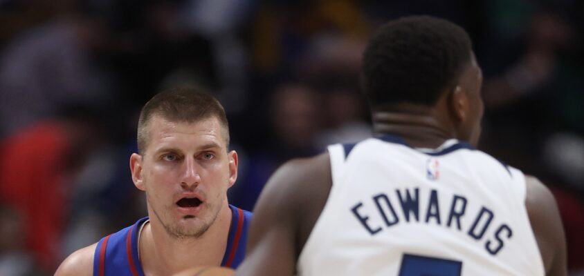 DENVER, COLORADO - MAY 04: Nikola Jokic #15 of the Denver Nuggets guards Anthony Edwards #5 of the Minnesota Timberwolves in the first quarter during Game One of the Western Conference Second Round Playoffs at Ball Arena on May 04, 2024 in Denver, Colorado.