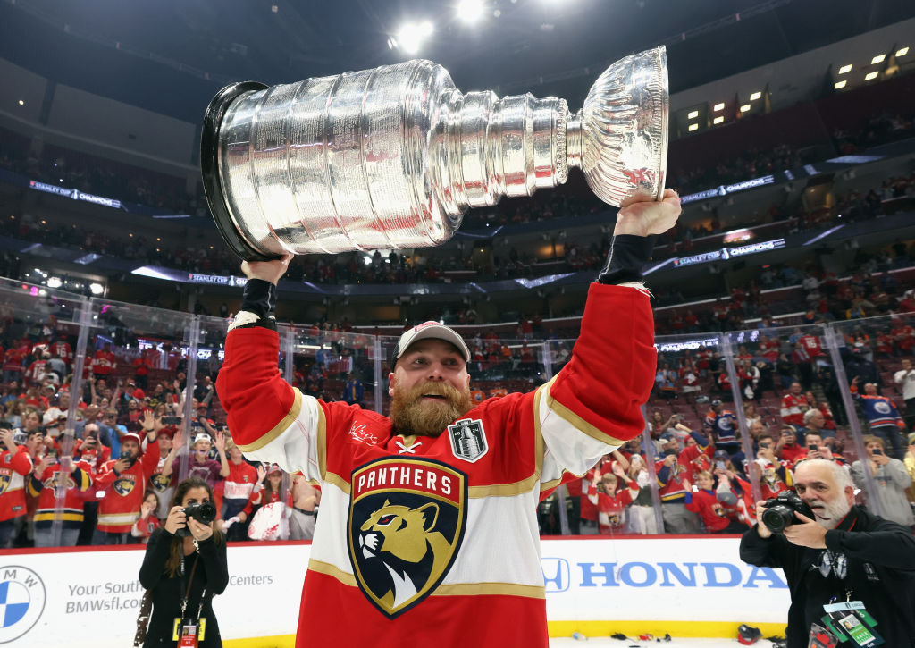 SUNRISE, FLORIDA - JUNE 24: Sam Bennett #9 of the Florida Panthers celebrates with the Stanley Cup following a 2-1 victory over the Edmonton Oilers in Game Seven of the 2024 NHL Stanley Cup Final at Amerant Bank Arena on June 24, 2024 in Sunrise, Florida