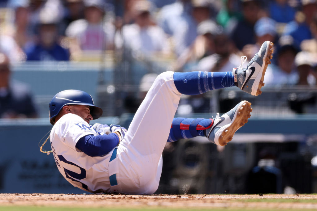 LOS ANGELES, CALIFORNIA - JUNE 16: Mookie Betts #50 of the Los Angeles Dodgers reacts after getting hit by a pitch during the seventh inning against the Kansas City Royals at Dodger Stadium on June 16, 2024 in Los Angeles, California.